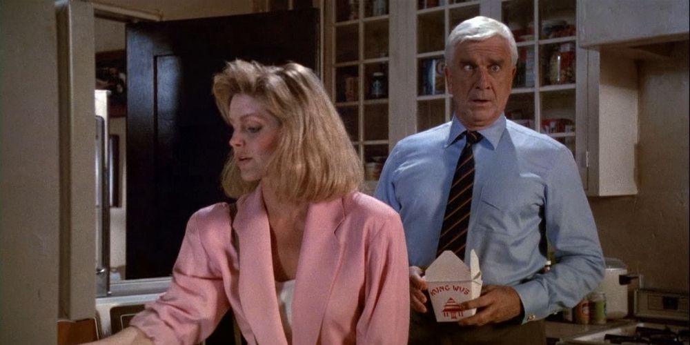 Drebin is about to faint from Chinese food in The Naked Gun