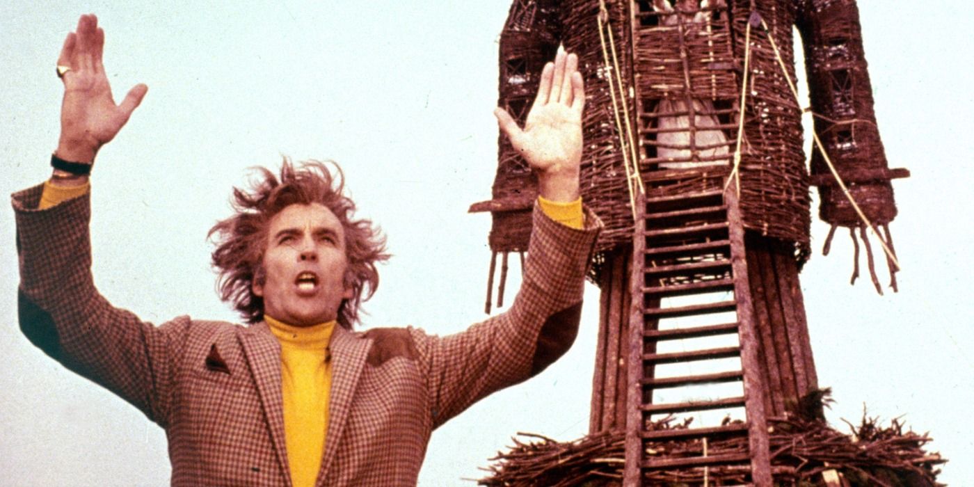 Christopher Lee stands in front of the Wicker Man