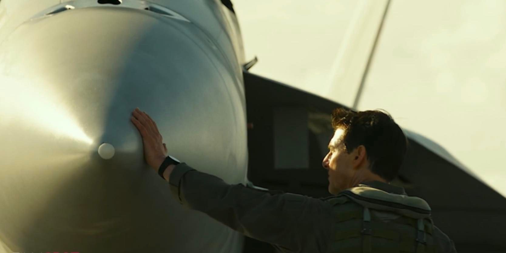 tom cruise maverick with plane top gun 2