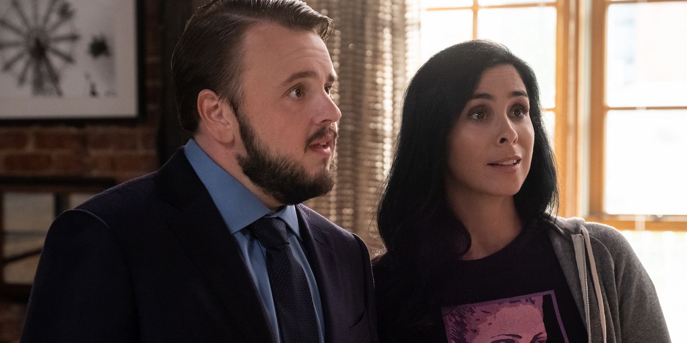 Sarah Silverman stands next to a man in Marry Me (2022)