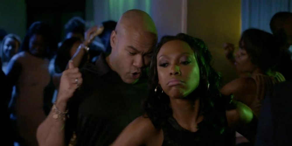 A man speaks into a women&rsquo;s ear in a club in Born Again Virgin