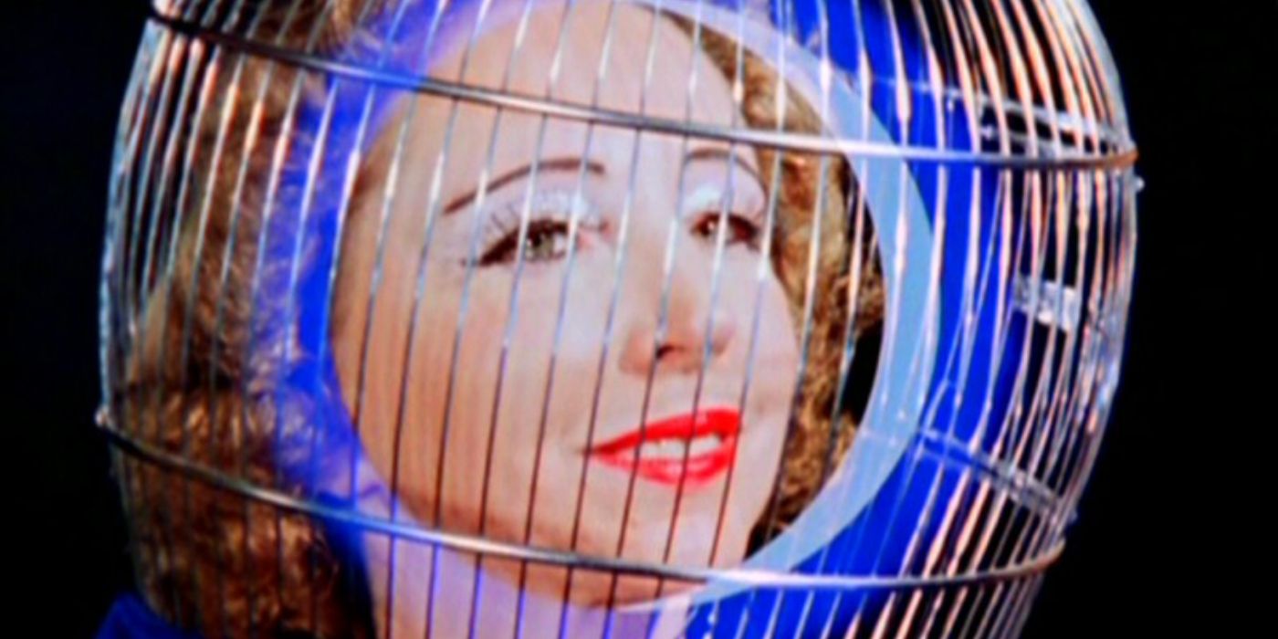 A woman in a bird cage in Magick Lantern Cycle.