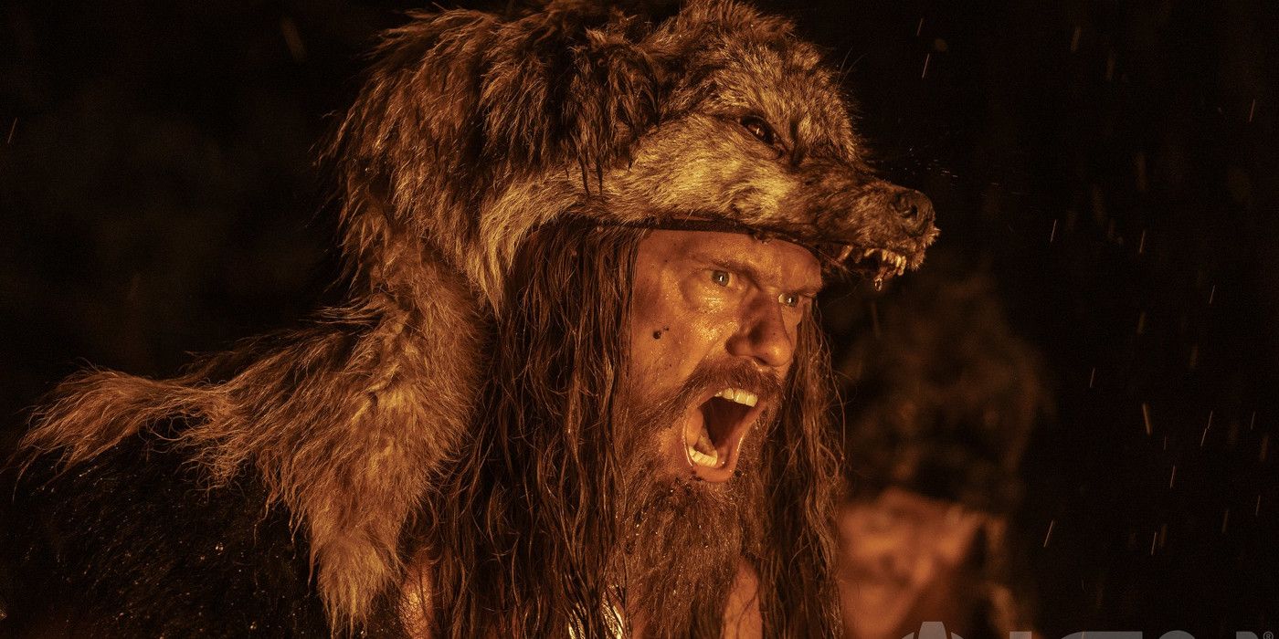 Actor Alexander Skarsgard wearing a wolf's head headdress in the movie The Northman