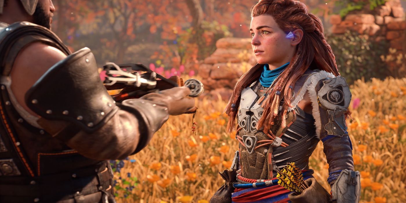 Aloy listening and learning in front of a man in Horizon Forbidden West.