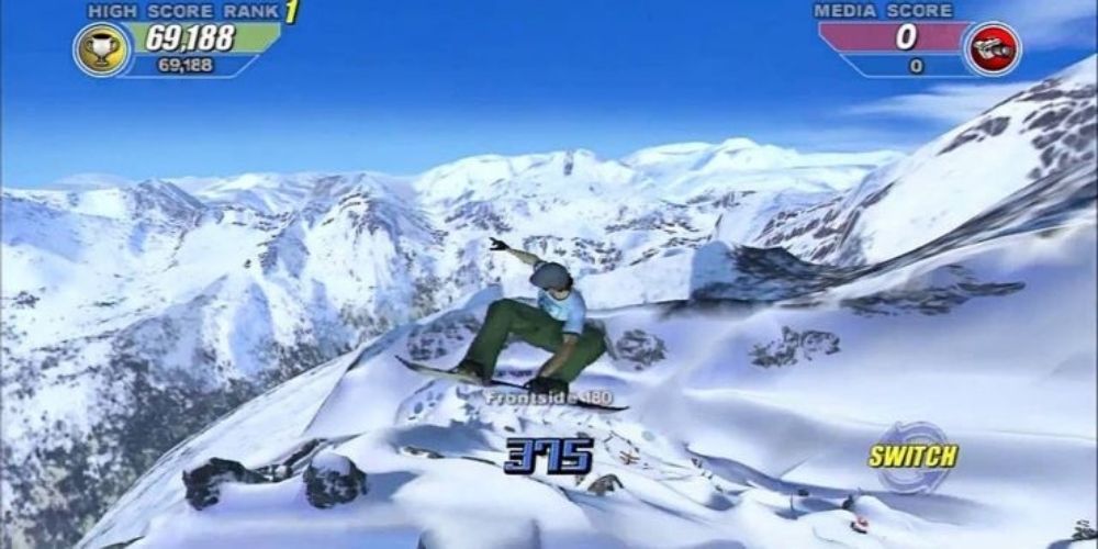 A player does a snowboarding trick in Amped 2 amidst a snowy backdrop
