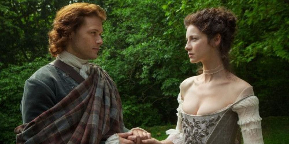 An image of Claire and Jamie looking at each other in Outlander