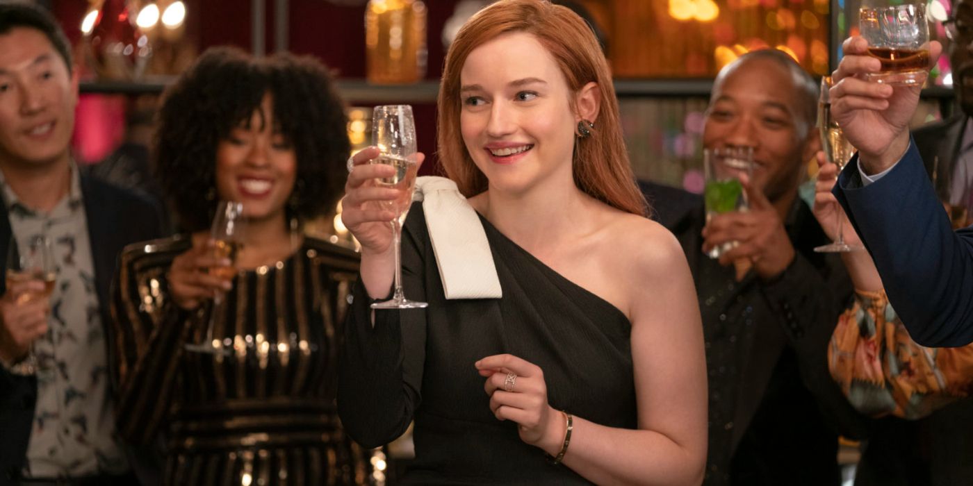 Anna holding a glass of champagne in Inventing Anna.
