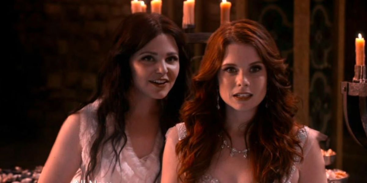 Snow and Ariel at a ball surrounded by candles in Once Upon A Time