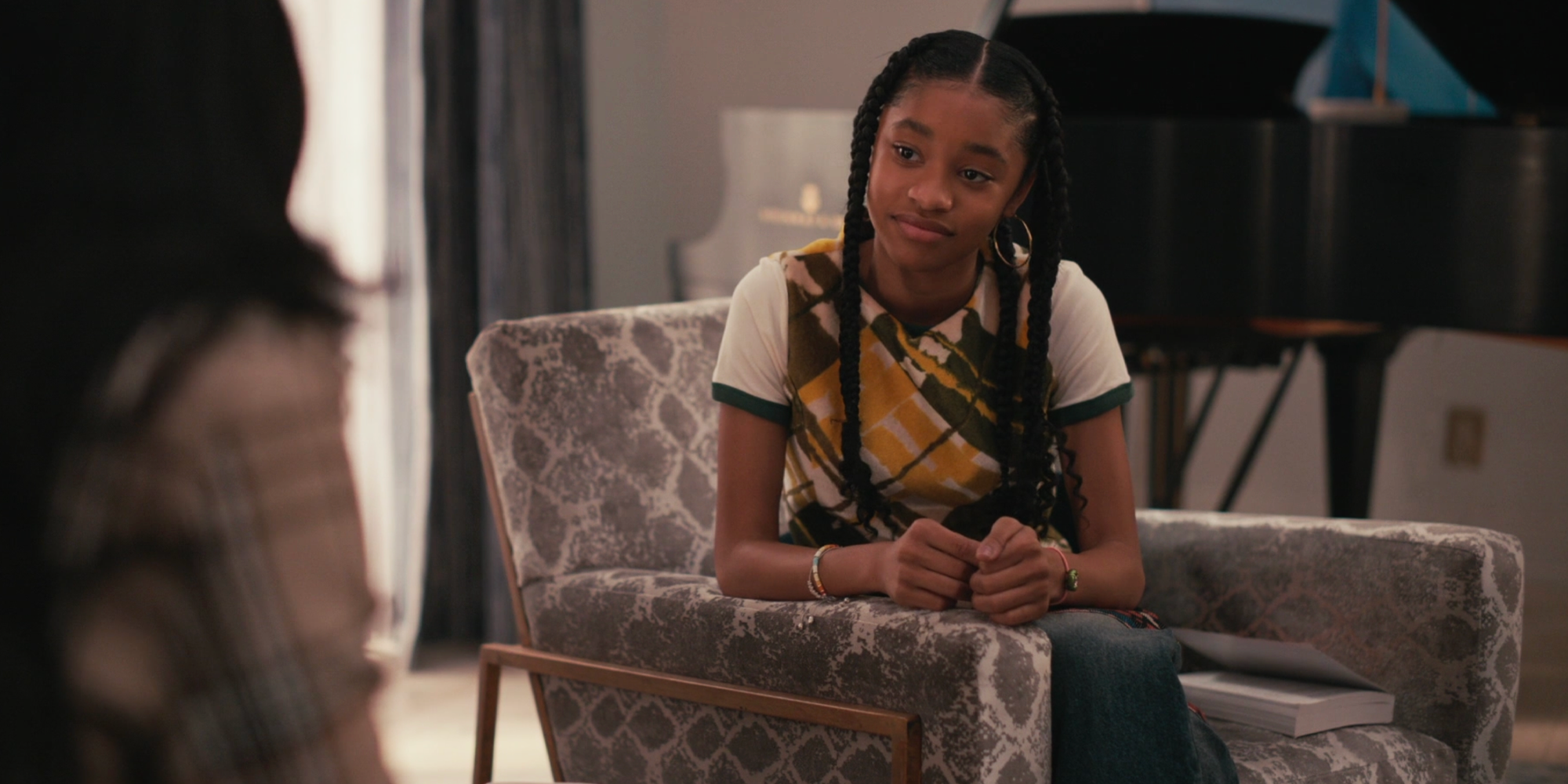 Ashley Banks sitting in a chair in Bel Air