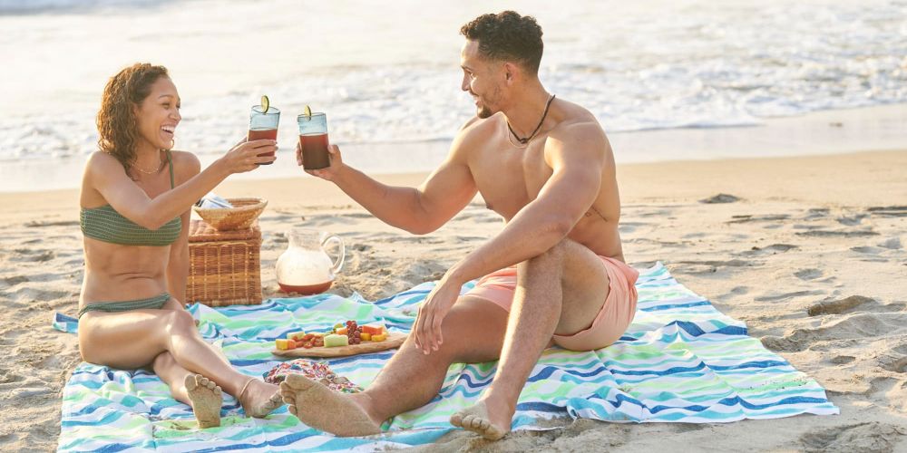 Thecca cheers each other on the beach in Bachelor in Paradise