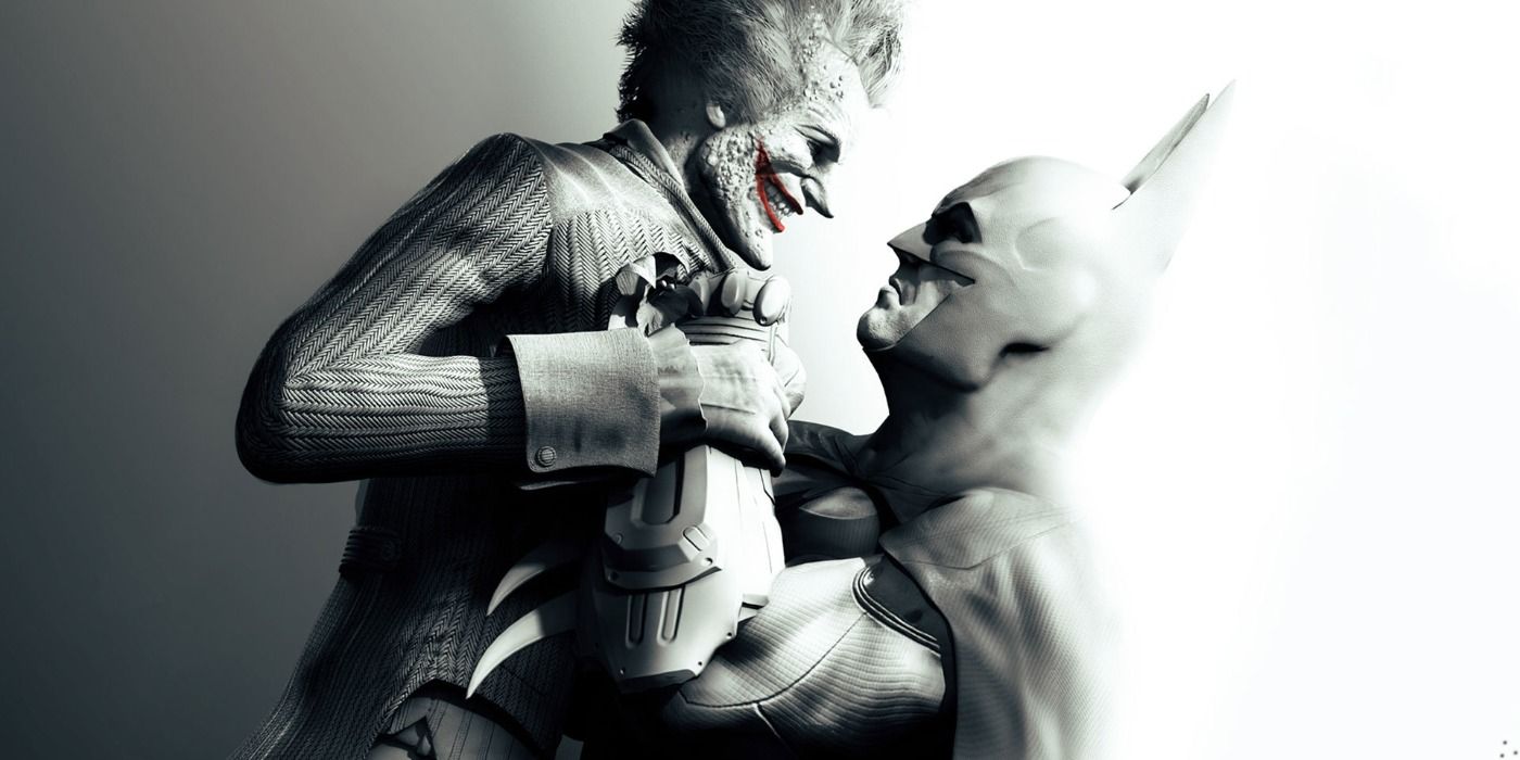 Batman holding the Joker up by his collar in Arkham City promo art