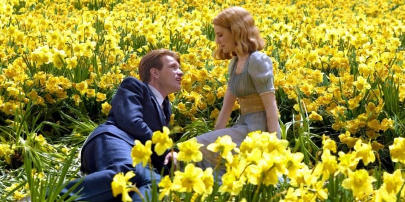 Sandra and Edward Bloom having a picnic in a field of yellow flowers in Big Fish.