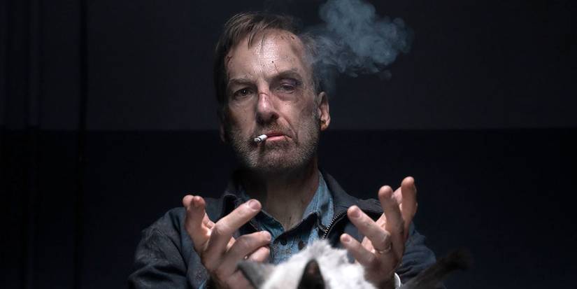 Bob Odenkirk smoking and handcuffed in Nobody