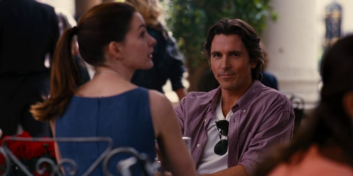Bruce with Selina Kyle at a café in Italy in The Dark Knight Rises