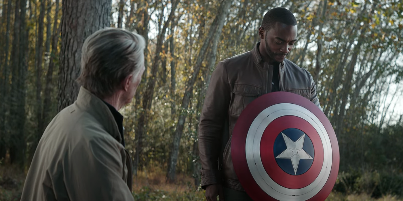 Captain America gives Falcon his shield.