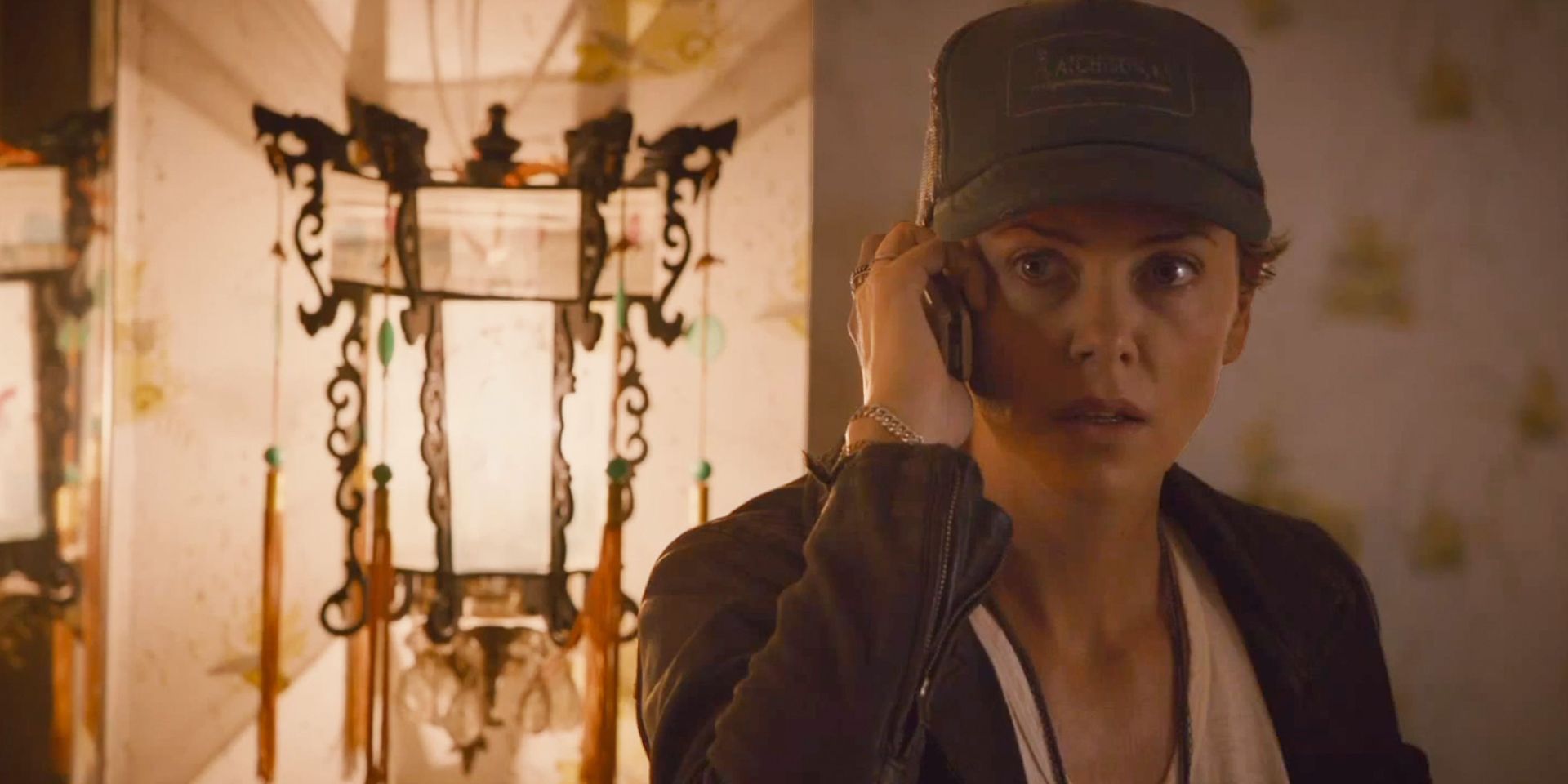 Charlize Theron talks on the phone in Dark Places