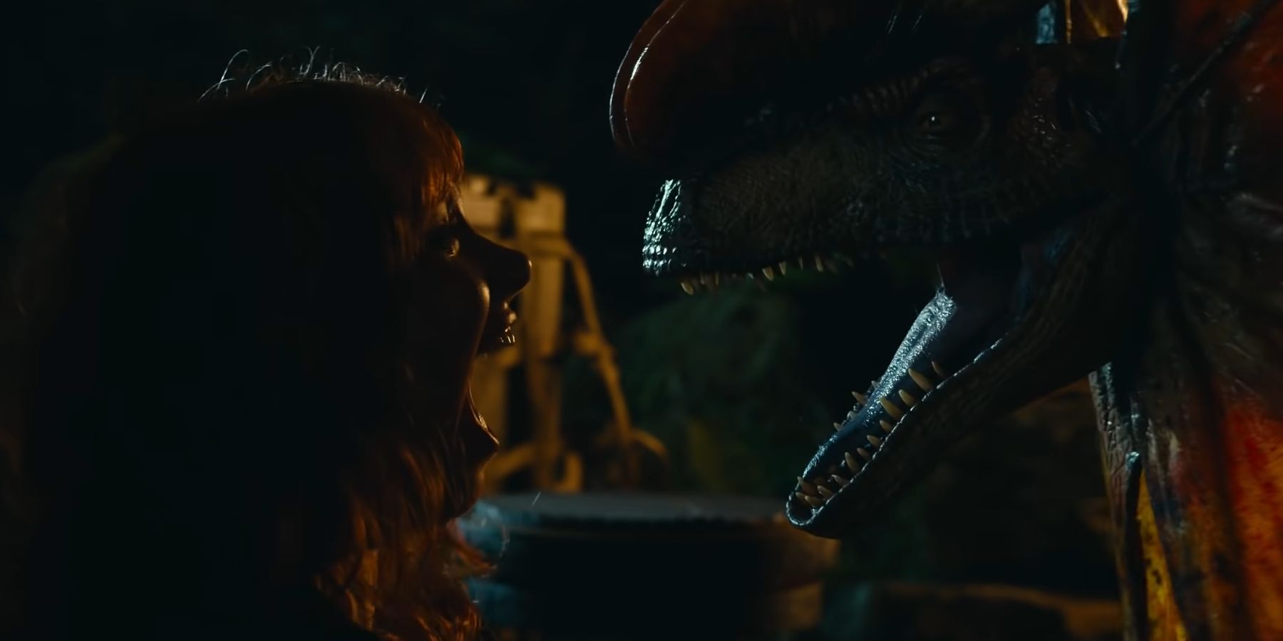 Claire Dearing screaming in fear from a Dilophosaurus in Jurassic World Dominion