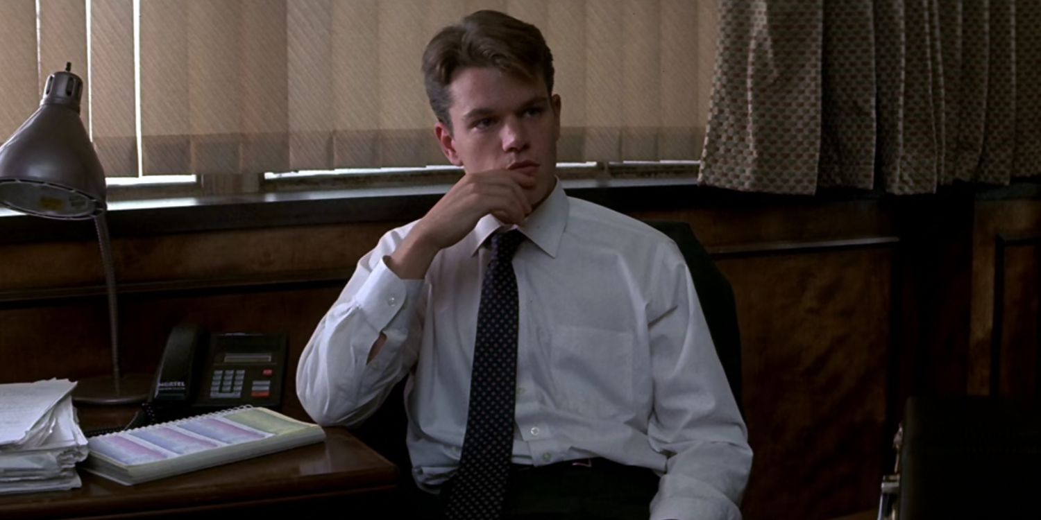 Matt Damon sitting at a desk in The Rainmaker