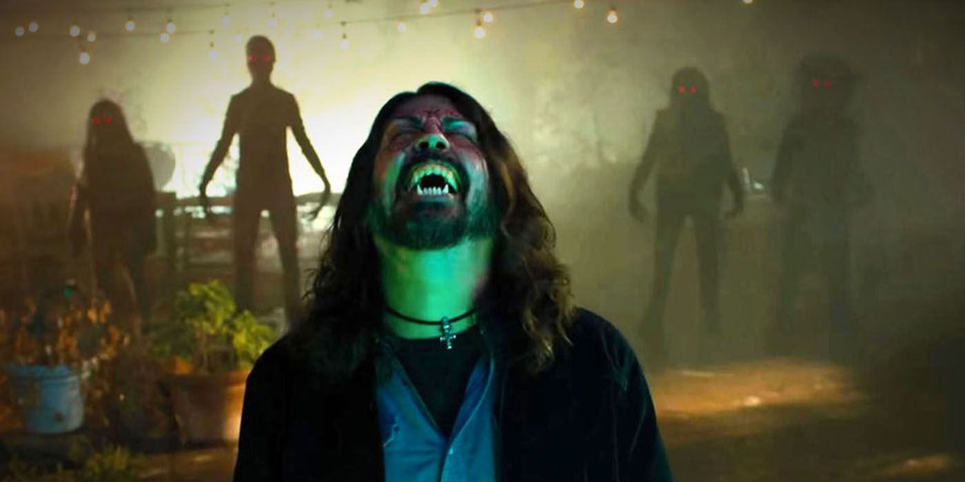 Dave Grohl yelling with demons behind him.