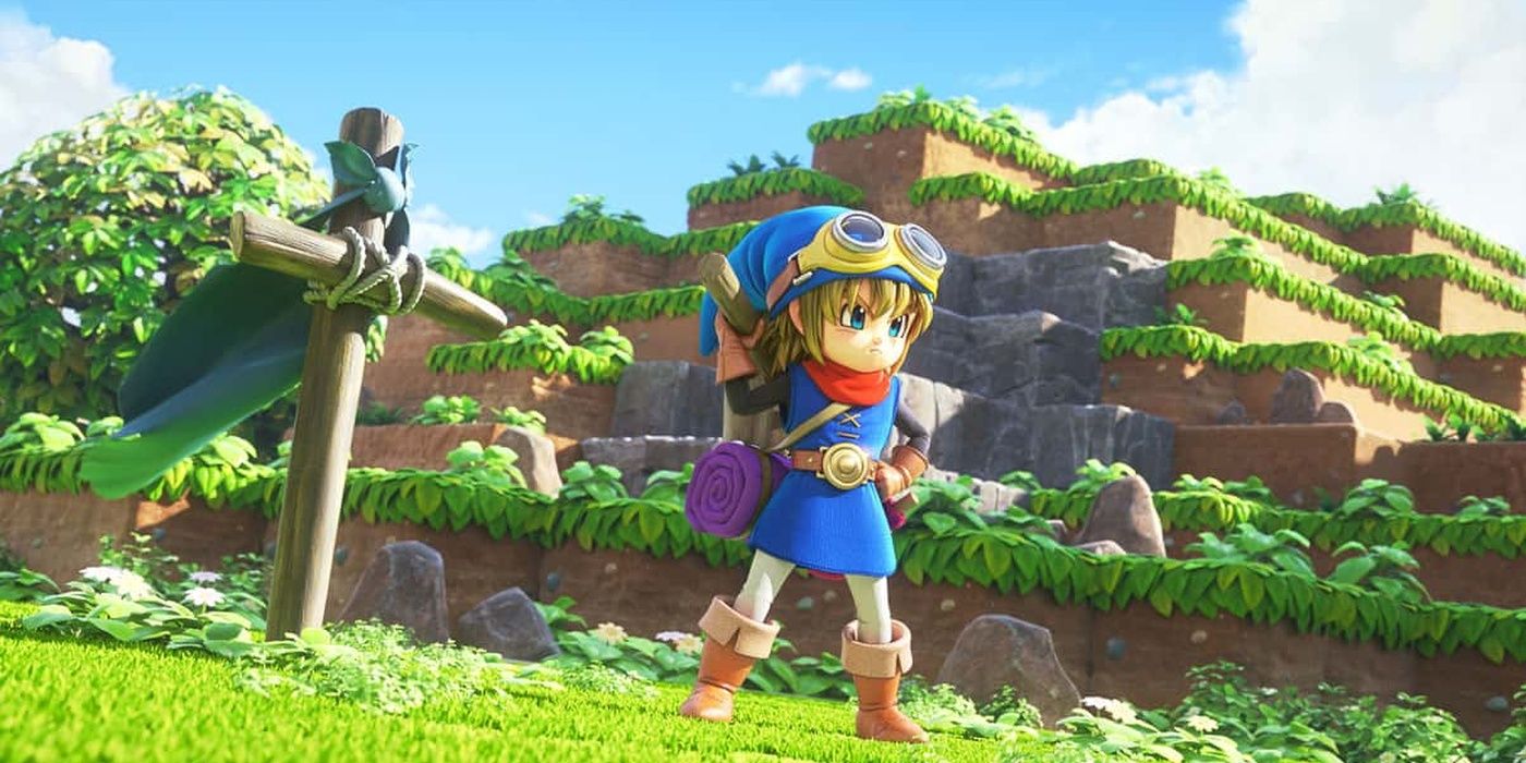 A blue-clad hero stands against a hill in Dragon Quest builders