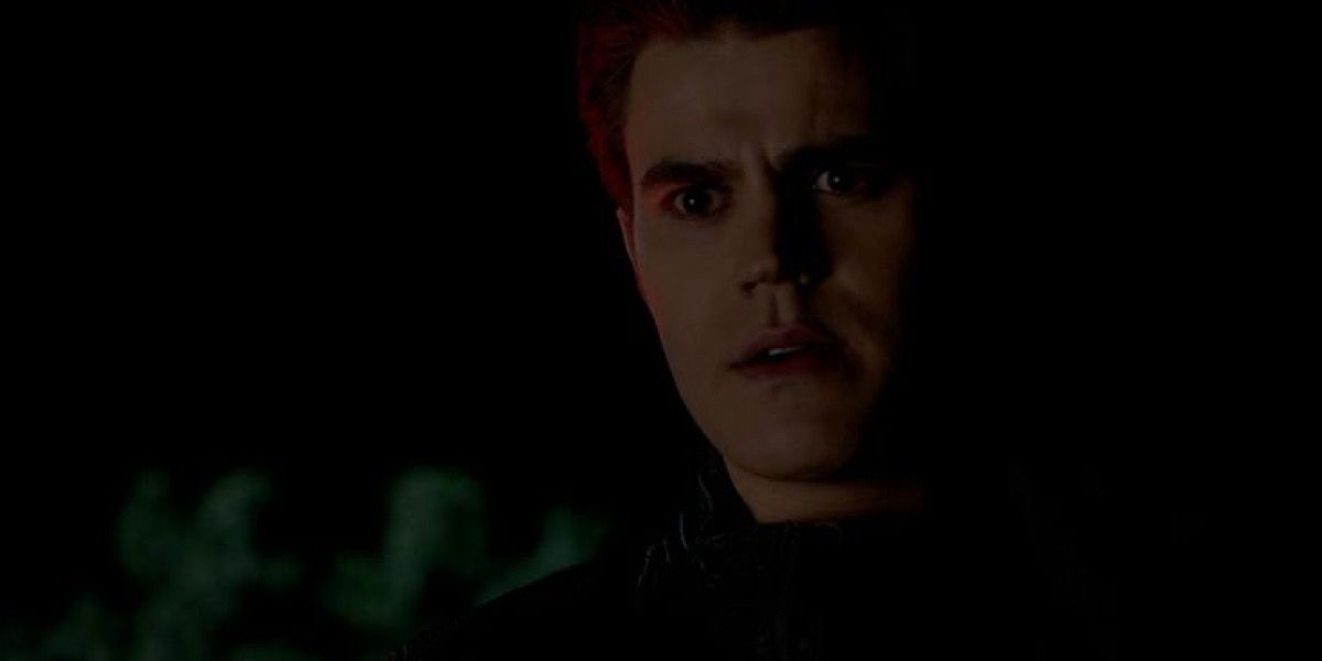 Silas looking down at someone, shocked.