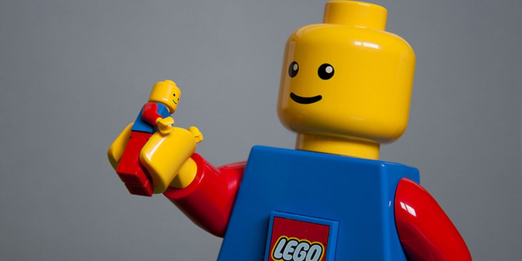 Generic LEGO Man holding a small version of himself