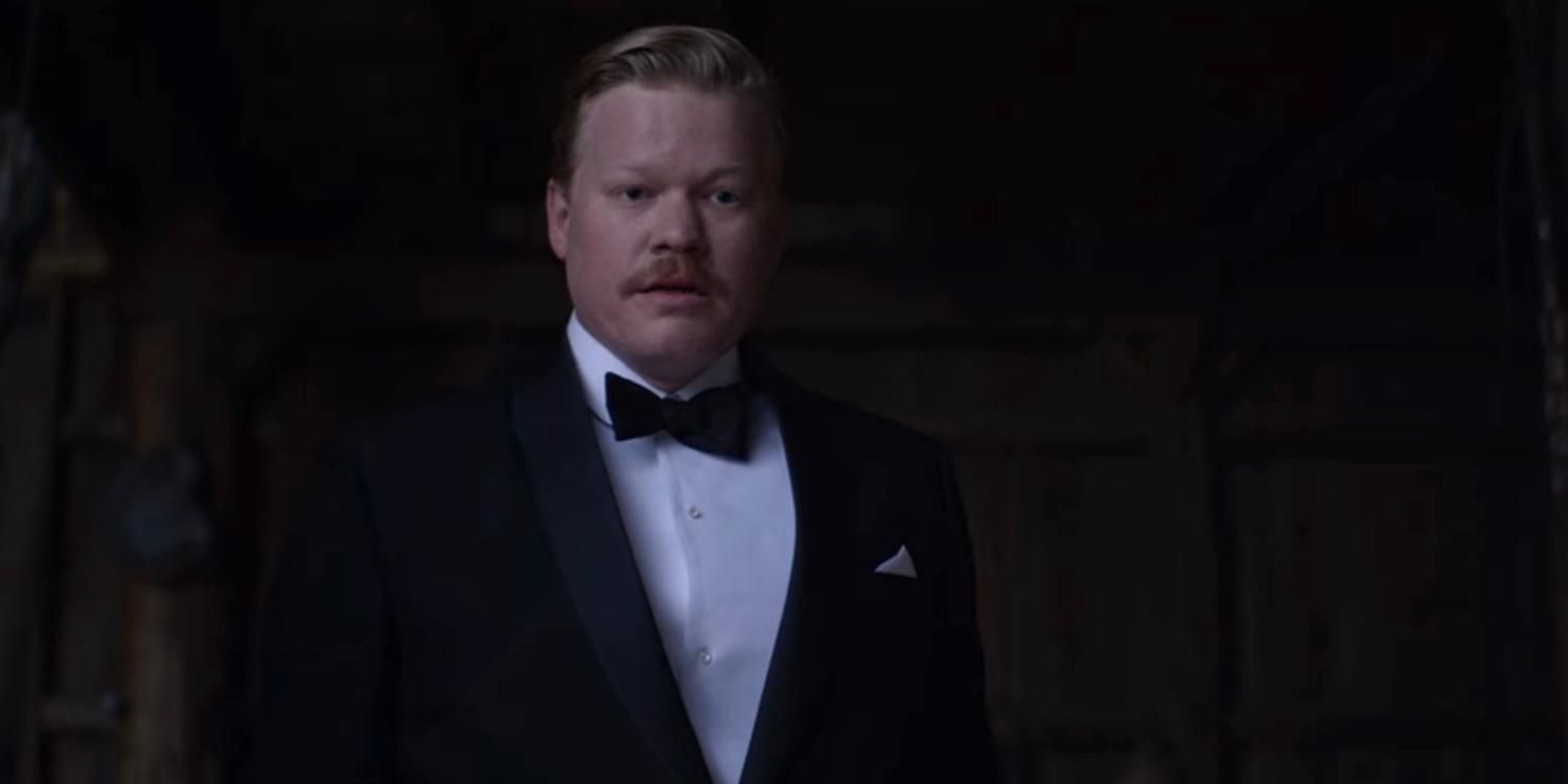 George in a suit with his mouth open in The Power of the Dog