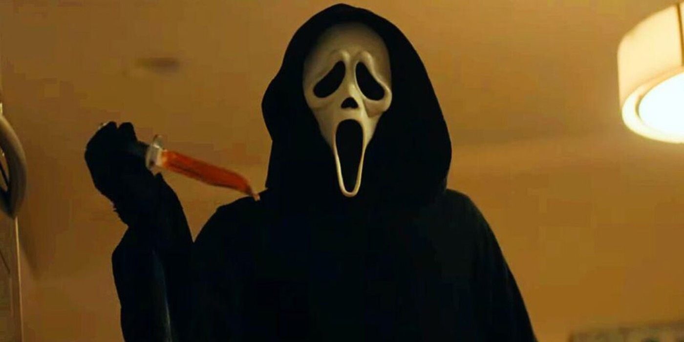 Ghostface looms over the camera with a bloody knife in his hand