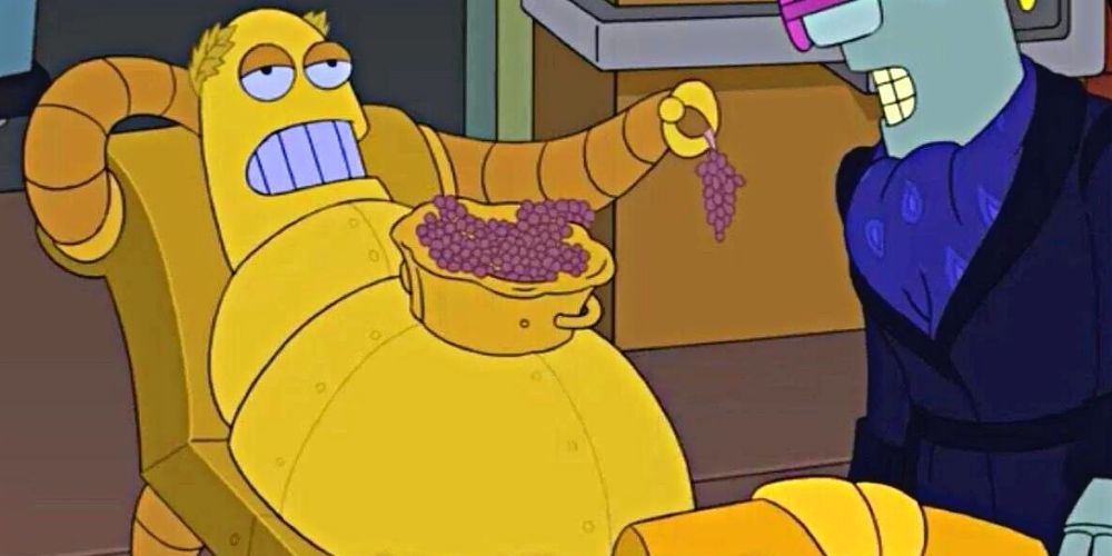 Hedonismbot lounges with a bowl of grapes