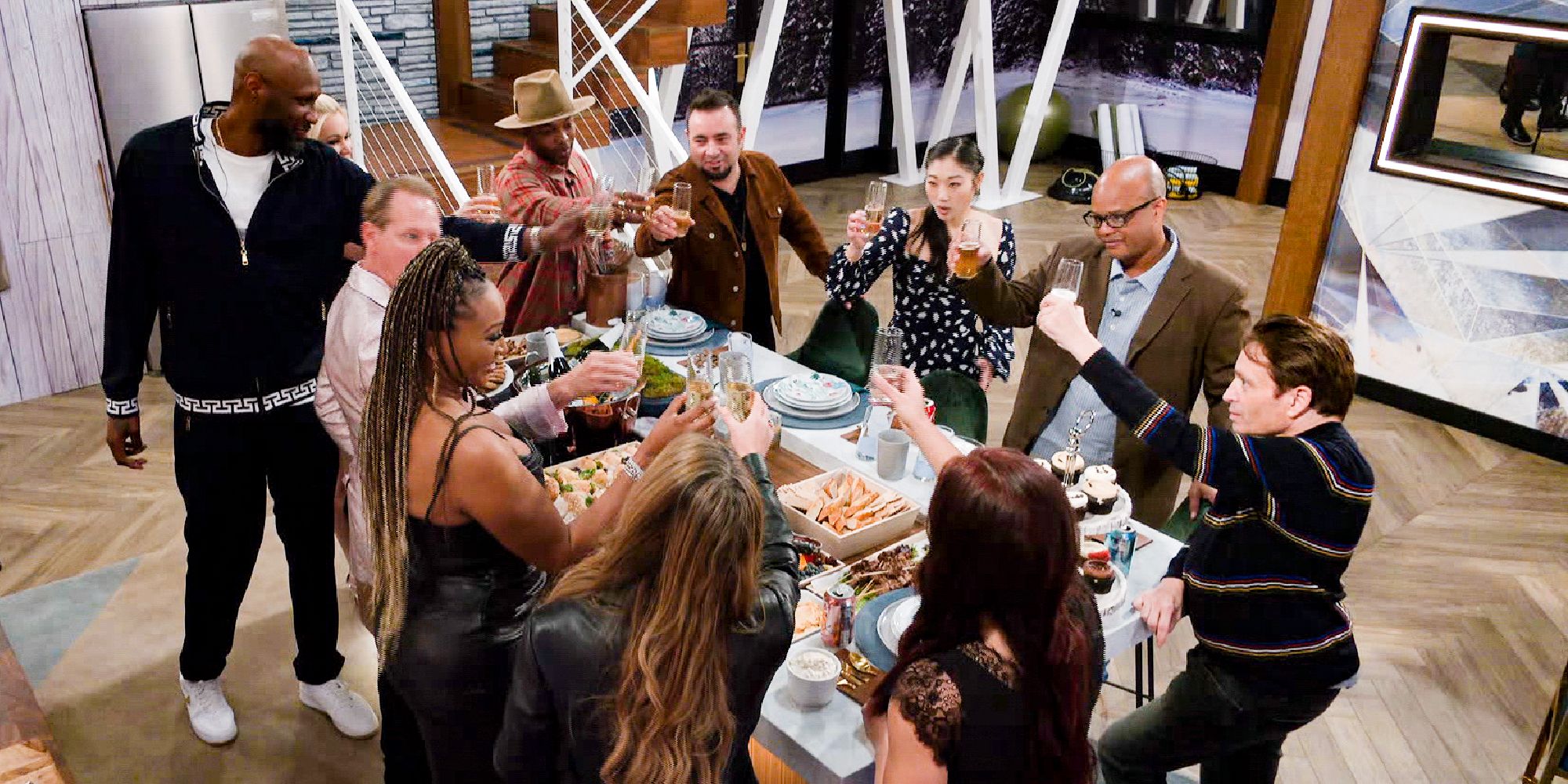 Houseguests cheering with champagne on Celebrity Big Brother 3 premiere