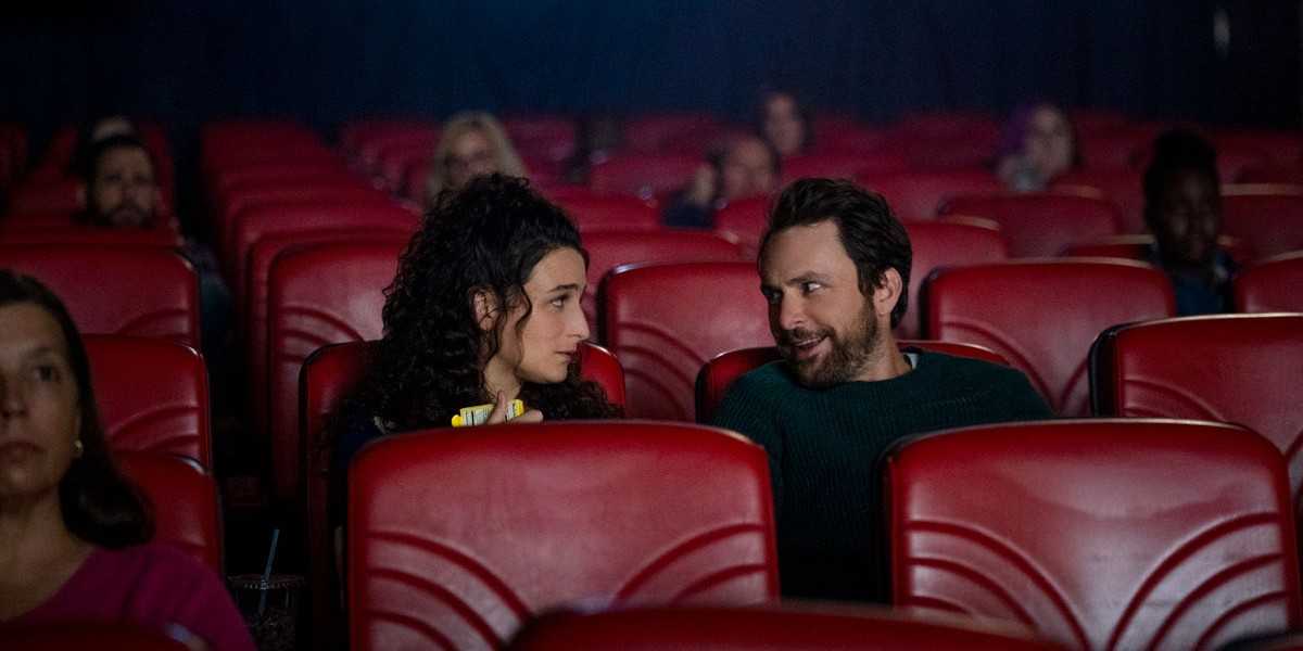 Emma and Peter talking in a movie theater in I Want You Back