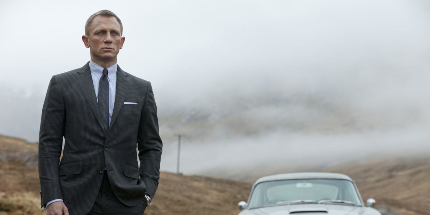 James Bond standing by his car in Skyfall