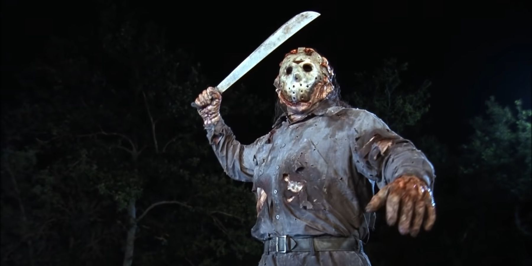 Jason Voorhees wielding his machete in a spotlight in Jason Goes To Hell The Final Friday