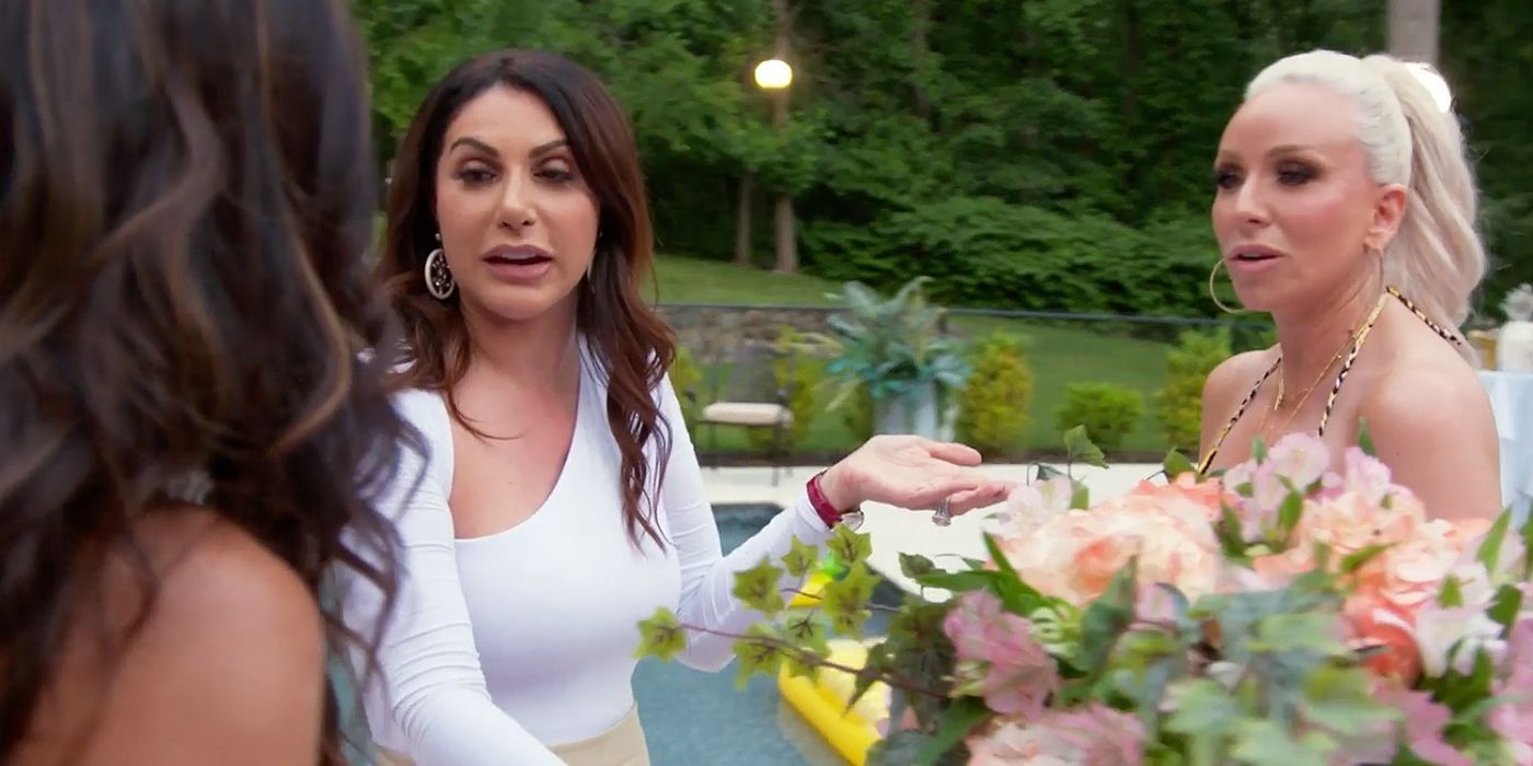 Jennifer and Margaret talking to Teresa at the pool party on RHONJ