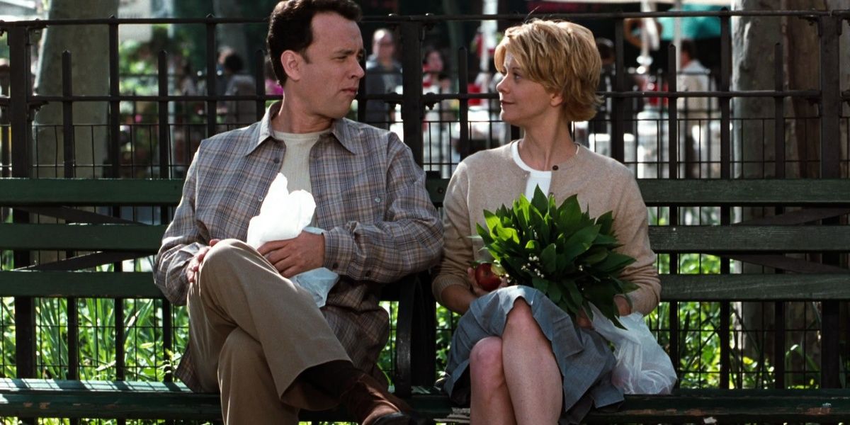 Joe and Kathleen sit on a bench in You've Got Mail