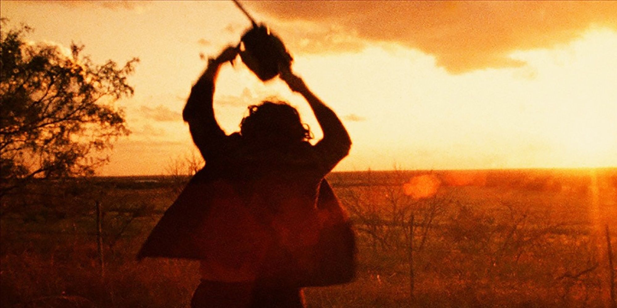 Leatherface standing in a field in The Texas Chainsaw Masscare
