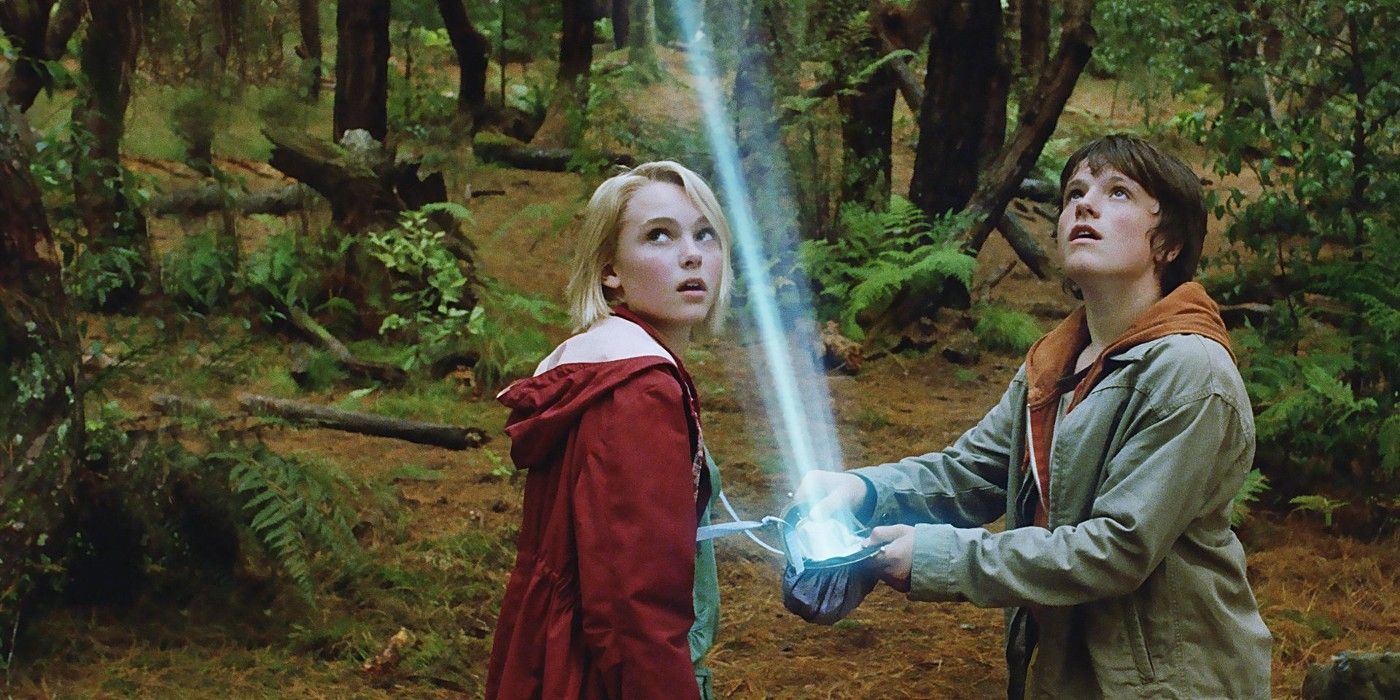 Leslie and Jess stare at a bright blue beam in Bridge to Terabithia