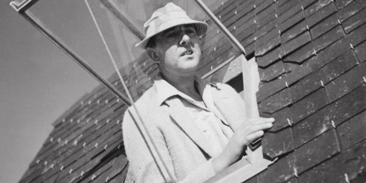 Mr. Hulot leans out of a window from Monsieur Hulot's Holiday