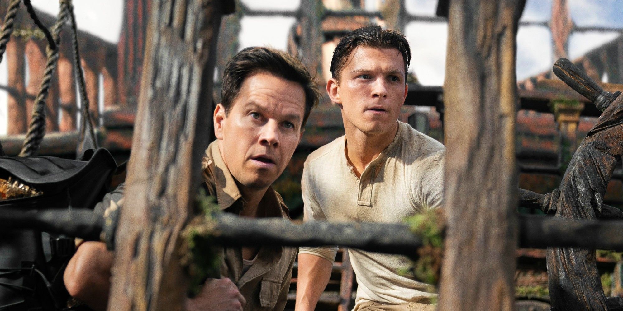 Mark Wahlberg and Tom Holland hiding on a pirate ship in Uncharted