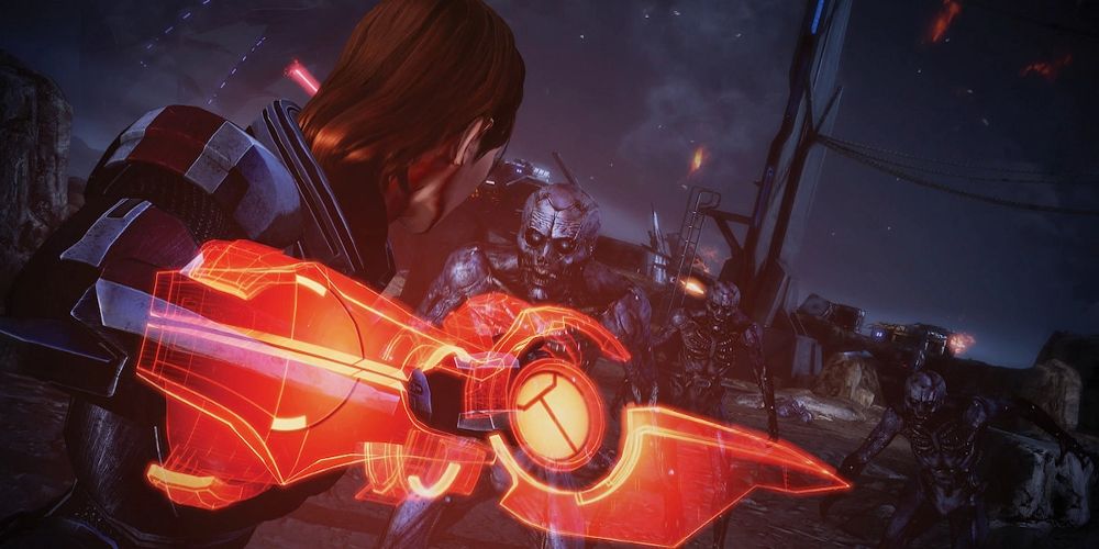 Eve fights enemies with an orange weapon in Mass Effect Legendary Edition