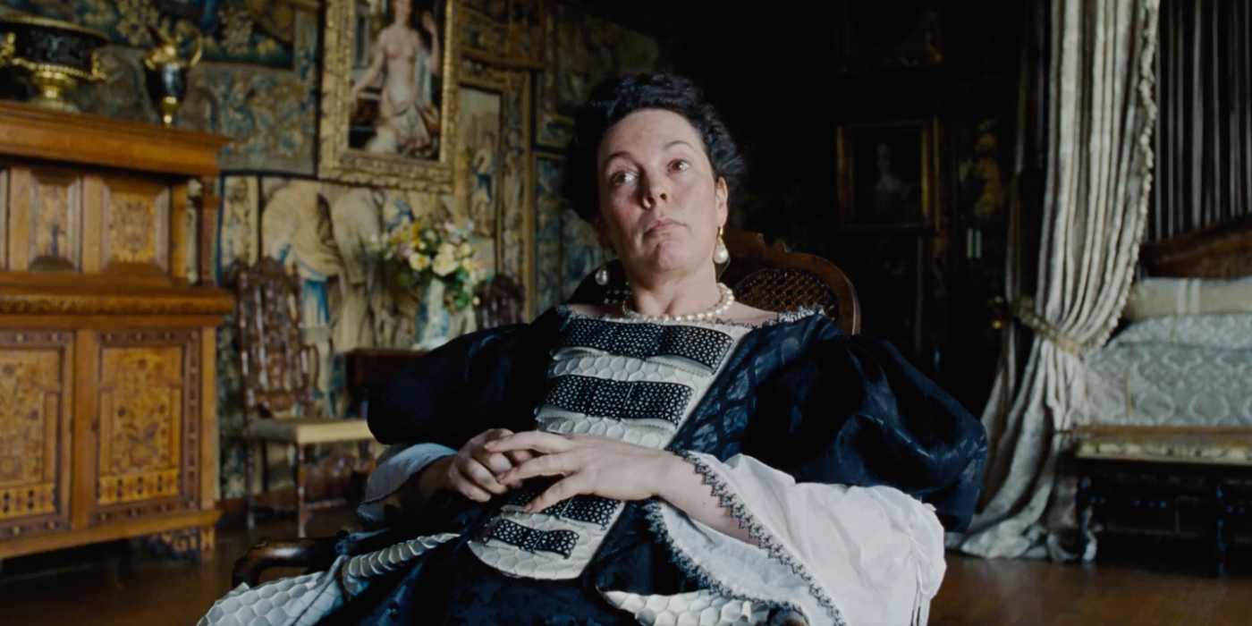 Olivia Colman sitting down in The Favourite