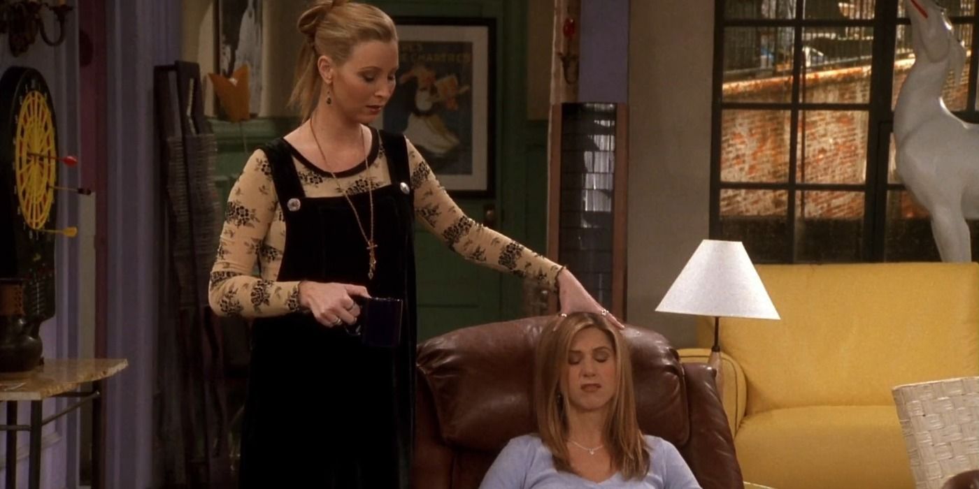 Phoebe holds Rachel's head at Monica's in Friends