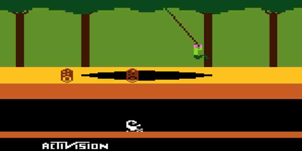 Harry is swinging over a pit and avoiding logs in Pitfall!