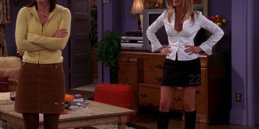 Rachel wearing a Collared Shirt With Mini Skirt And Knee High Boots on Friends.