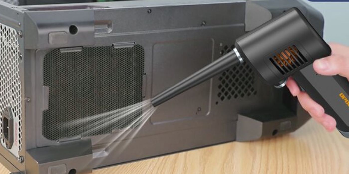 An air duster being used on a monitor