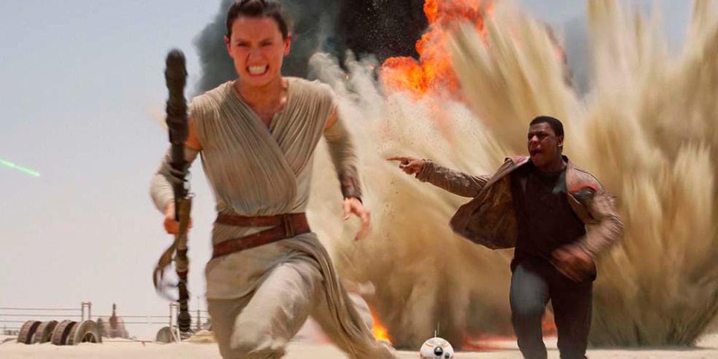 Rey and Finn running from explosions in Star Wars: The Force Awakens.