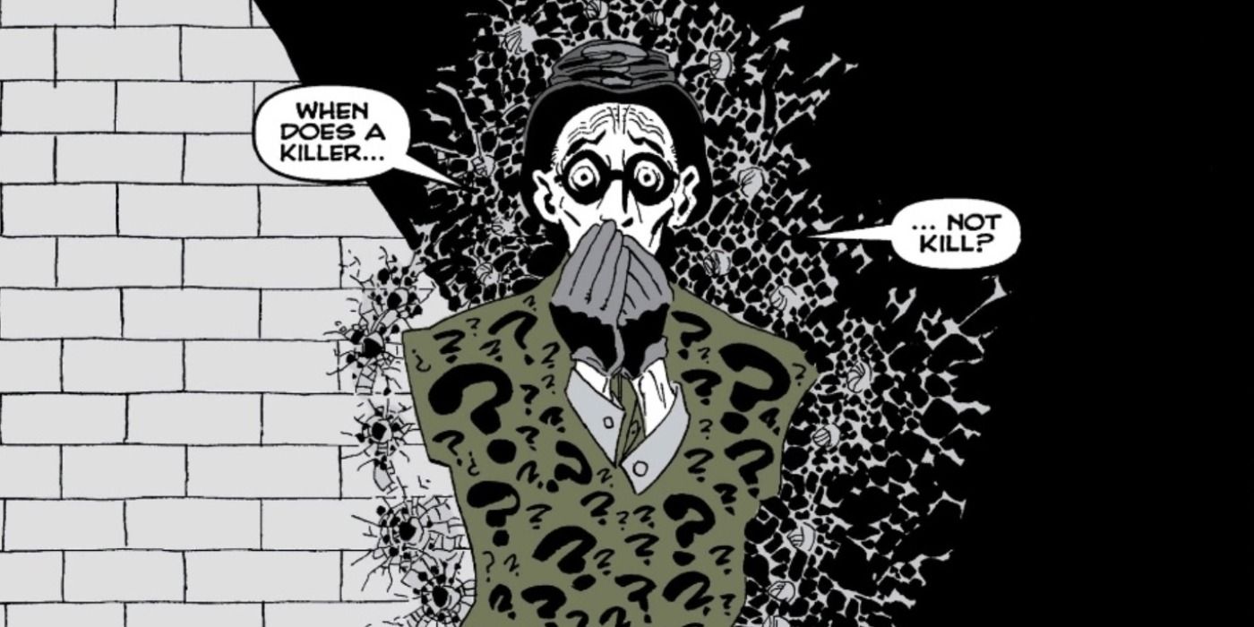 Riddler terrified against a wall outline with bullet holes in The Long Halloween