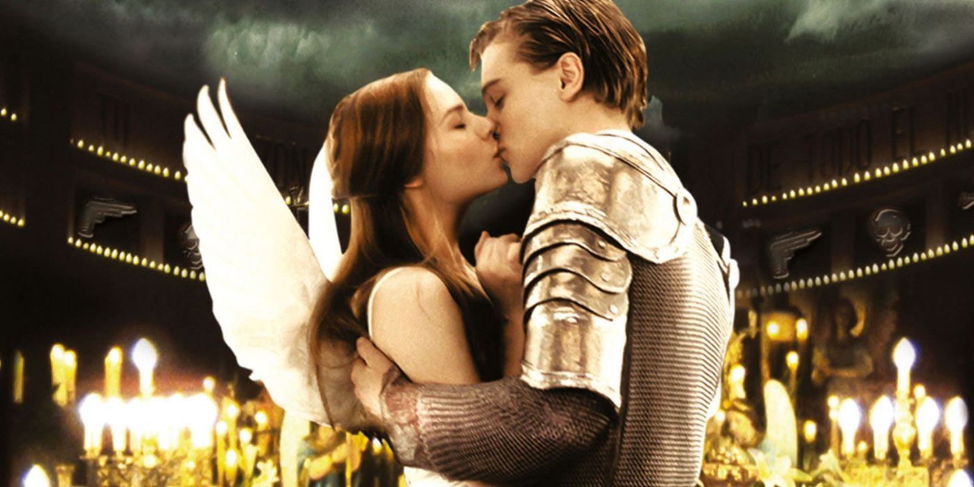 Romeo and Juliet kissing in front of a sea of lit candles.