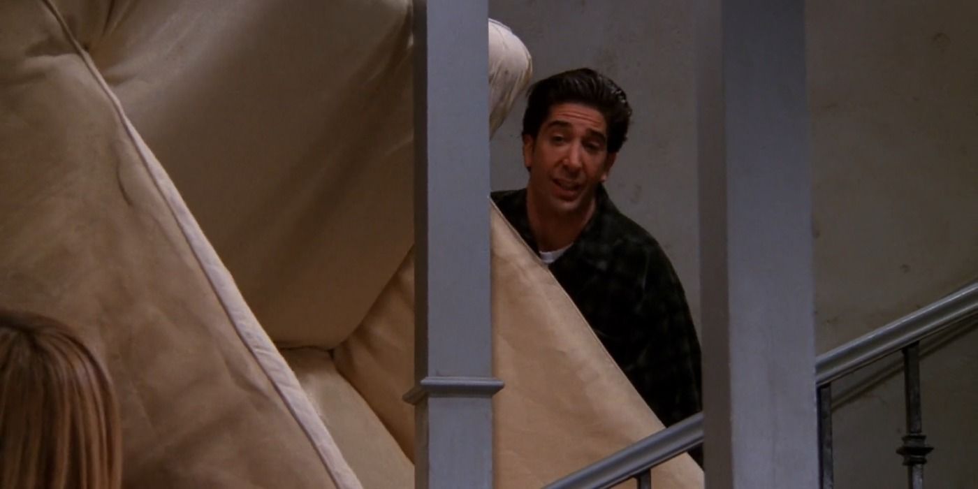 Ross lifts his couch up the stairs in Friends