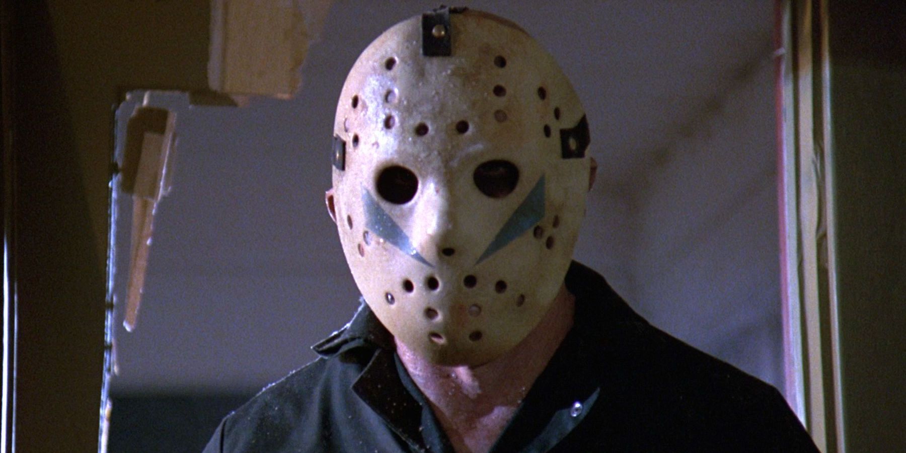 Roy Burns as Jason Voorhees breaking through a door in Friday The 13th Part V The New Beginning